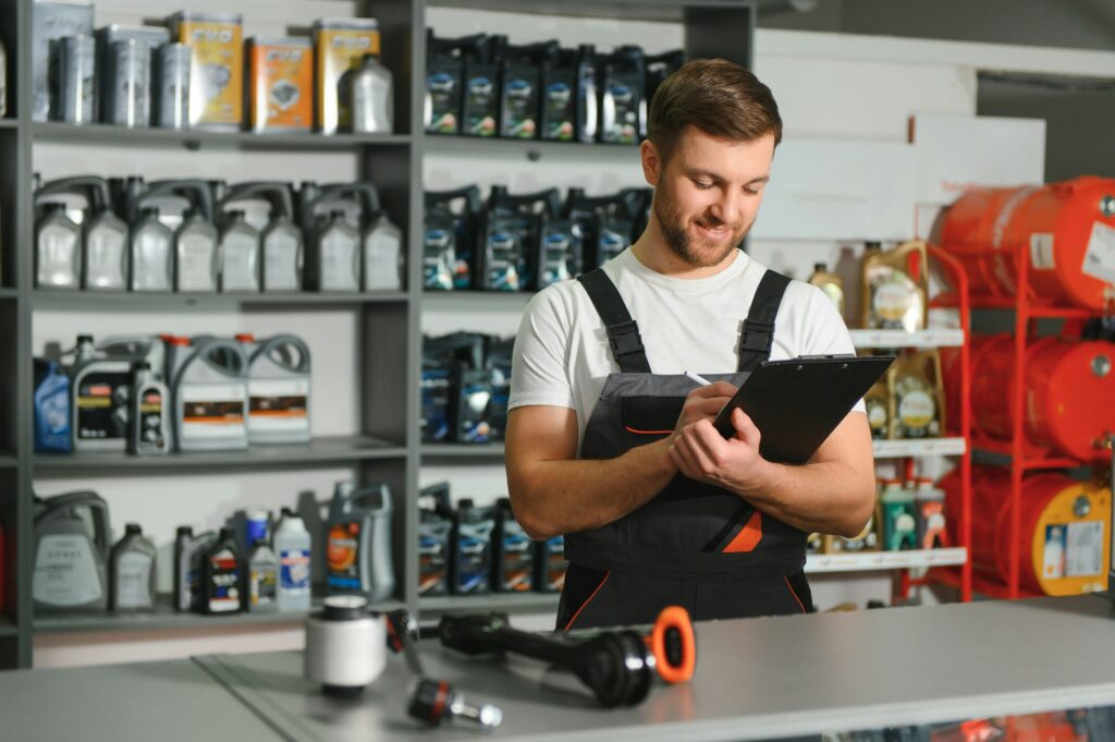 A salesman in an auto parts store. Retail trade of auto parts